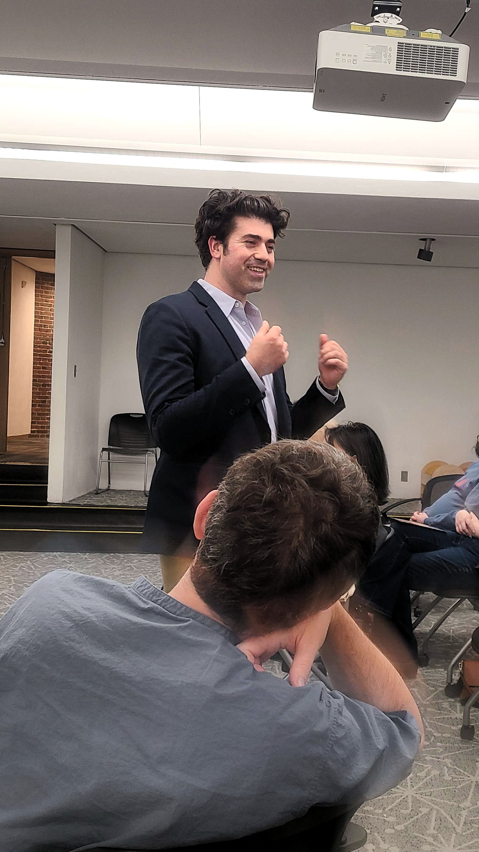 Jason Poulos speaking with constituents at the Brookline town hall, Coolidge Corner Library, June 2, 2026