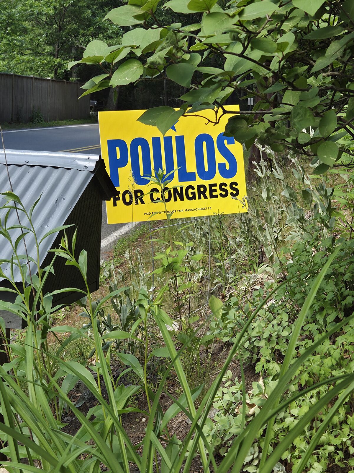 A Poulos for Congress lawn sign displayed in a yard in MA-04