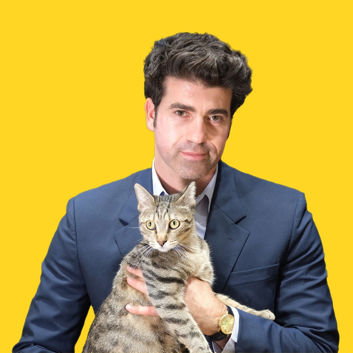 Jason Poulos holding a rescue cat